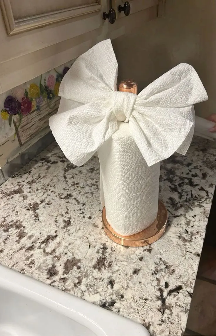 Neatly folded paper towels on a clean kitchen counter