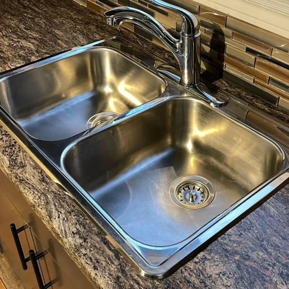 Polished stainless steel kitchen sink