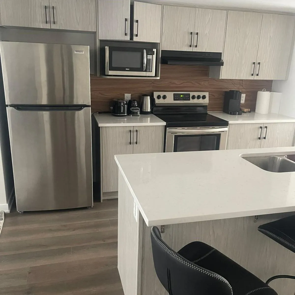 Clean, organized kitchen with stainless appliances